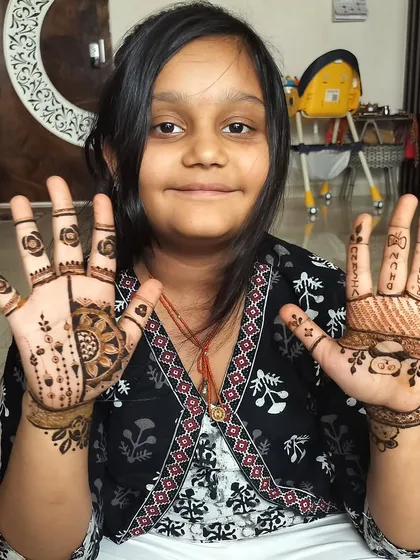 My cute client showing off her Diwali mehndi! It’s always a joy to create designs for kids and see their happy faces.