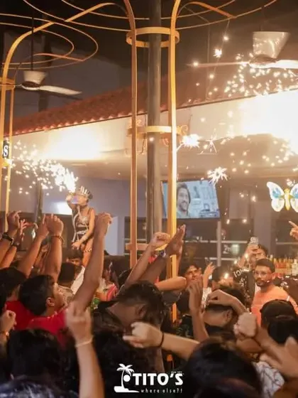 The crowd at Tito's goes wild as performers with sparklers dance on the bar. This kind of high-energy spectacle is a signature of my parties.