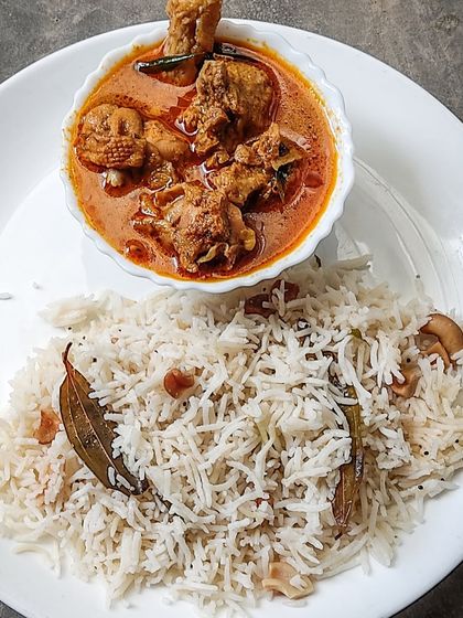 A beautiful shot of Naati Koli Saaru with Ghee Rice, featured as part of an article on the rich, rustic flavours of South India's regional cuisine.