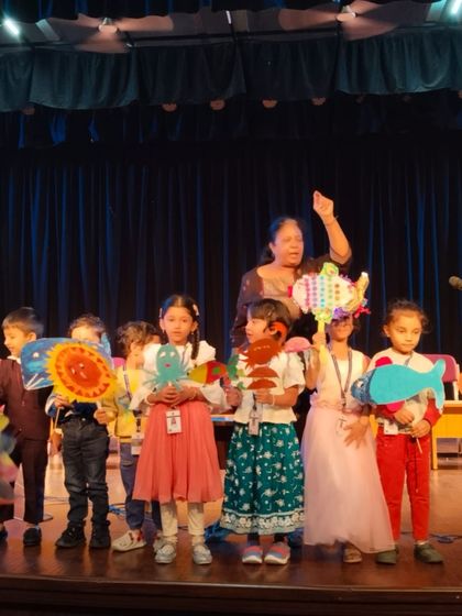 Another beautiful shot from a Children's Day school event. Our tellers use interactive activities like puppet making to ensure the story stays with the children long after it's told.