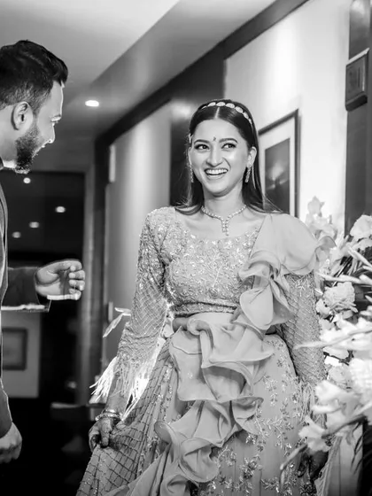 The black and white version of a beautiful candid moment. The groom's happy reaction to seeing his bride-to-be is timeless in this emotional photograph.