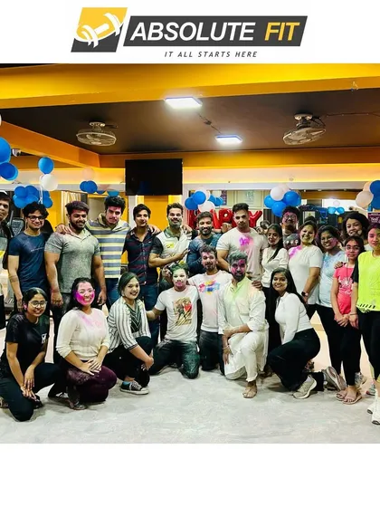 A memorable Holi with our gym family, decorated with blue and white balloons.
