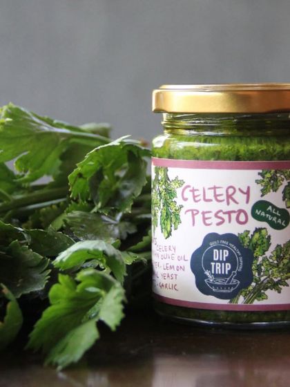 The star of the show: a jar of my Celery Pesto, made from fresh celery leaves. It's a keto-friendly, all-natural, and flavorful alternative for your meals.