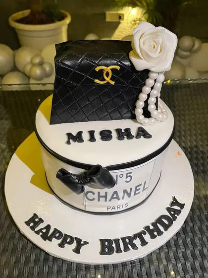 For the fashion lover, I designed this chic Chanel-themed birthday cake. The details, from the quilted pattern to the iconic logo and pearl string, make it a stunning centerpiece for a stylish party.
