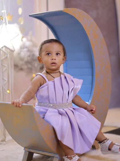 This series shows different angles and poses on our popular crescent moon prop. The set is versatile, allowing for sitting, reaching, and looking-up shots against the starry sky.