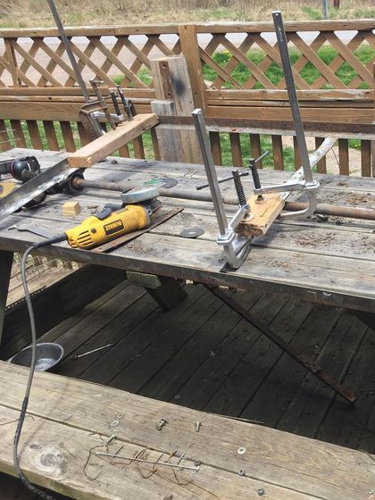 The workbench tells the story. Tools, clamps, and metal parts show the sifter being rebuilt once again. This is our design 5.5, a testament to not giving up.