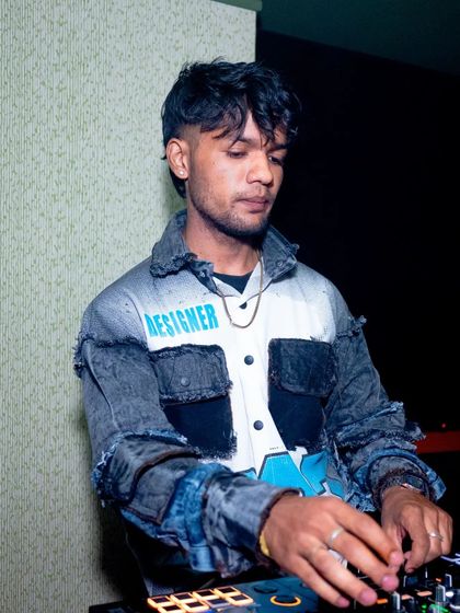 A close-up of me at the decks, showing the details of my mixing technique.