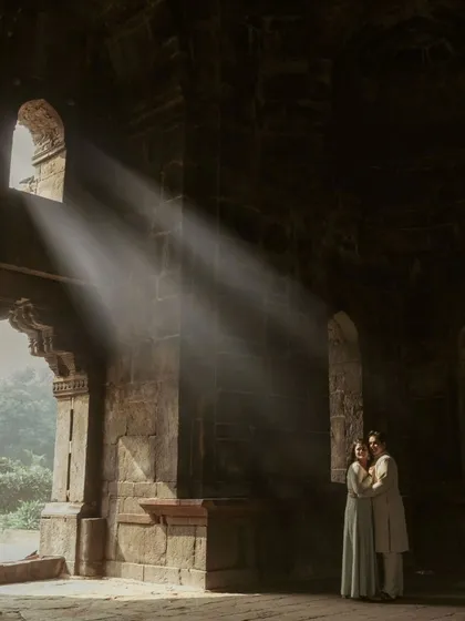 Using light to paint a story. In the quiet corners of a historic Delhi monument, I found these divine sunbeams that perfectly framed Akshay and Bani, turning their pre-wedding portrait into a timeless piece of art.