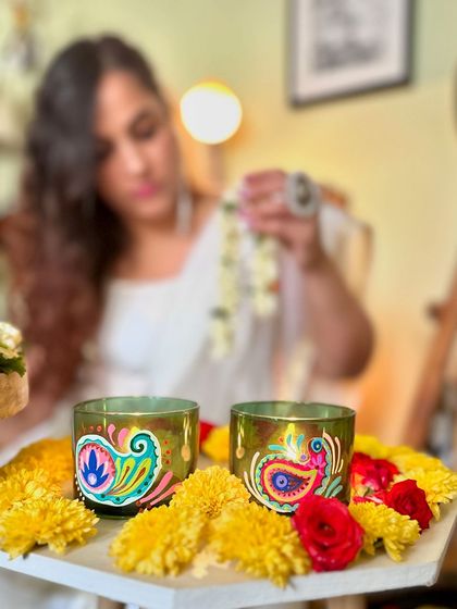 Our exclusive festive collection, including these paisley-painted candle holders, is here to make your Diwali special.