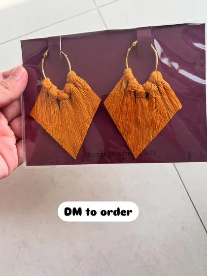 These mustard yellow macrame earrings are perfect for adding a pop of warm color to your look. The diamond tassel design is one of my favorites.
