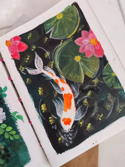 A serene koi pond painted with gouache. Besides florals, I love exploring other nature scenes that feel peaceful and dreamy. This piece shows how I use the opaque quality of gouache to create depth and contrast between the dark water and the bright koi fish.