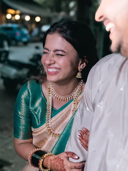 Wrapped in love and laughter, this couple is ready to begin their beautiful journey together. A perfect candid moment.