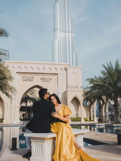 A romantic moment captured in Dubai, featuring our mustard yellow trail gown. The dress adds a touch of glamour and elegance to this iconic location.
