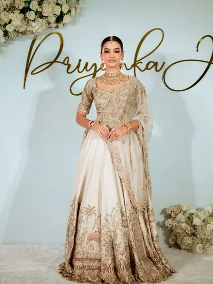 A full-length view of the model showcasing the complete look against our masterclass backdrop. I teach how makeup, hair, and outfit work together to create a cohesive and stunning bridal profile.