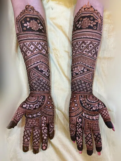 A symphony of art and symbolism, this full bridal work combines floral bands, geometric nets, and flowing paisleys for a truly captivating result.