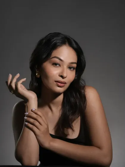 A serene portrait that highlights the soft contouring and natural lip color. This type of understated makeup is versatile for a wide range of commercial and editorial projects, from skincare ads to model test shoots.