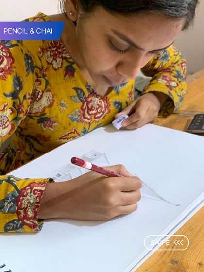 The quiet intensity of our studio is where progress happens. Here, a student works on a pencil sketch, fully absorbed in the process of bringing her vision to life.