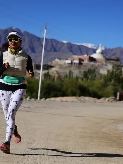 An athlete running strong with the stunning Ladakh landscape behind her. My training helps you adapt to and perform in beautiful yet challenging environments.