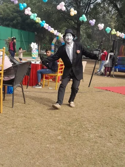 Our Charlie Chaplin entertainer in action at an outdoor birthday party, ready to amuse guests with his timeless performance.