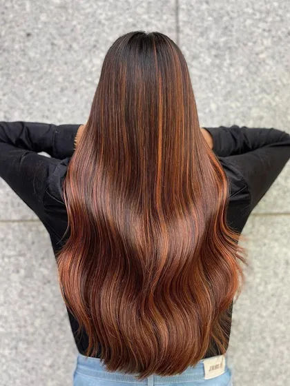 The beauty of copper tones on Indian skin is unmatched. This look features a rich copper balayage with fiery highlights that add warmth and radiance. I use Wella Professionals colors to create these vibrant, healthy-looking results that truly shine.