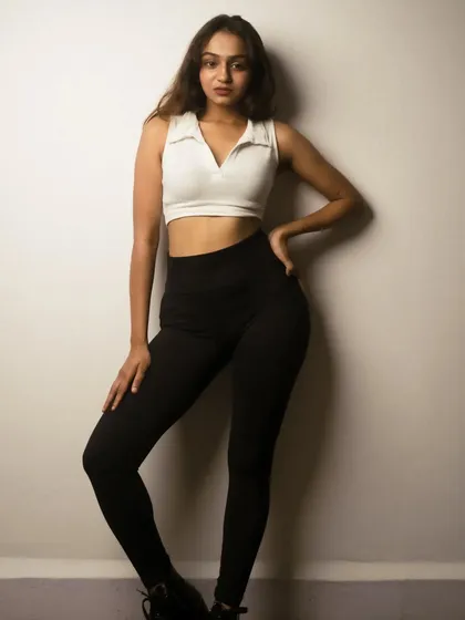 A clean, simple studio look for a model's portfolio. The lighting is even and flattering, highlighting the model's physique and expression.