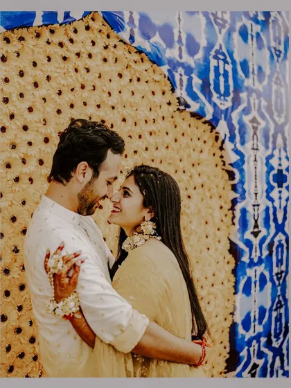 A close-up of Sonali and Hemant sharing a loving glance during their Haldi. This shot highlights the intimate connection between the couple, even in the midst of a lively celebration.
