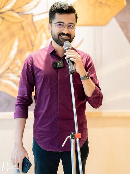 A poet and host engages with the audience. The event was a beautiful showcase of our country's collective voice.