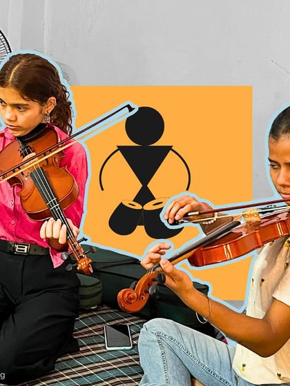 Two girls practice a violin duet, their focus and synchronization on display. Our classes encourage collaboration, teaching students to listen to each other and play as an ensemble.
