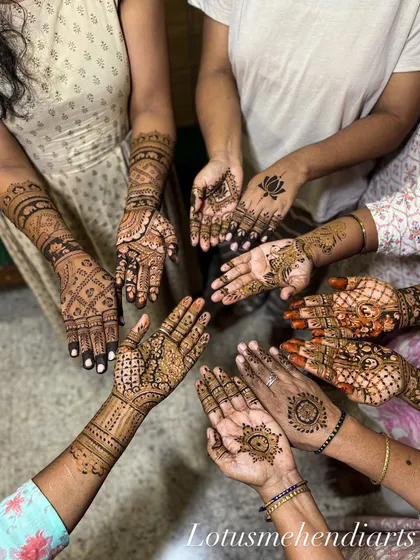 A beautiful moment with the bride's family and friends. We love creating a festive atmosphere where everyone gets a unique design, showcasing our team's ability to handle large groups efficiently.
