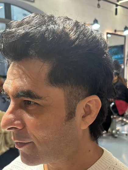 A closer look at the detail in a burst fade. Notice how the hair tapers down to the skin just behind the ear.