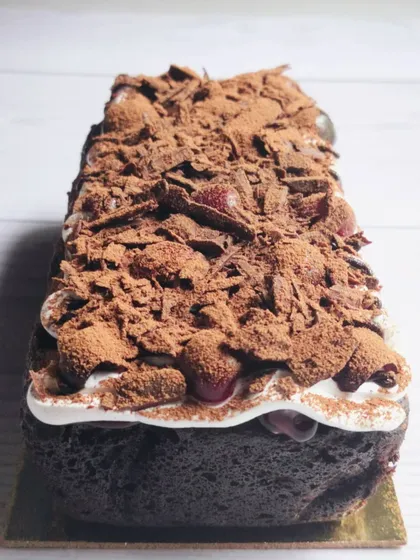 A tea-time twist on a classic. My Black Forest tea cake has a moist chocolate sponge, layers of whipped cream, and bursts of cherry, making it a simple yet indulgent treat.