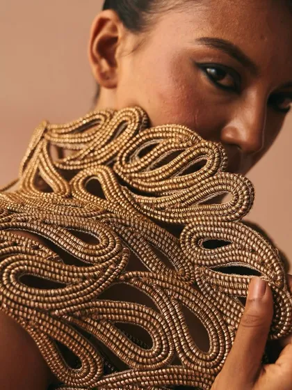 A close-up of the intricate, handcrafted cord work from my 'Cord Memory' collection. Zari threads are meticulously knotted and layered to create a rich, three-dimensional texture that tells a story of connection.