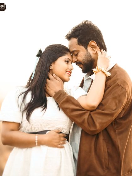 A close-up, intimate portrait from the same golden hour session. I focus on capturing the quiet moments of connection between a couple.