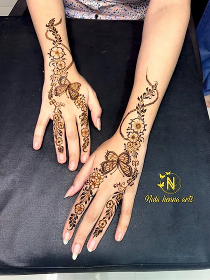 A fancy and dreamy mehandi design featuring a delicate butterfly. This style is light, modern, and perfect for someone who wants a unique and minimalist look.