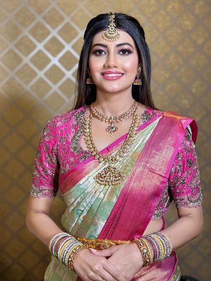 A bright and happy portrait of the bride. The makeup is clean and fresh, enhancing her beautiful smile.