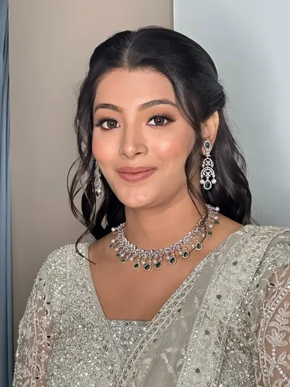 A portrait of my lovely bride. The makeup is soft and enhances her natural features, while the half-up hairstyle adds a touch of modern romance.