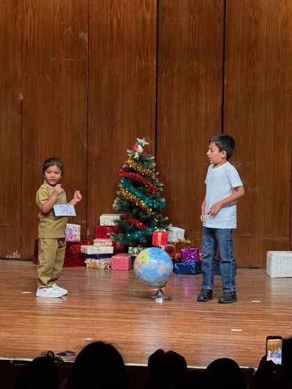 A postman delivers a message in this charming skit, where students learn to use props and costumes effectively.