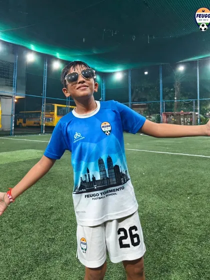 This young player brings some superstar style to the pitch after a training session.