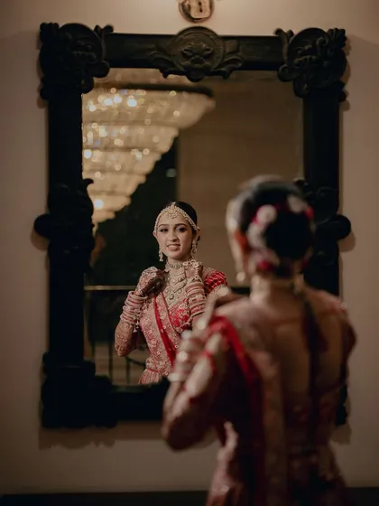 A reflection of beauty. Twinkle looks in the mirror at her final Maharani bridal look, a perfect blend of tradition and modern elegance.