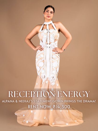Bring the drama with 'Reception Energy' in this statement gown by Alpana & Neeraj. The white floral appliqué on a nude base with a halter neck and fishtail cut ensures you will make a memorable entrance.