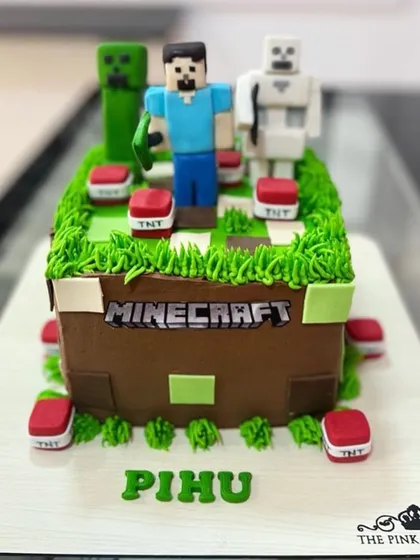 Another angle of the square Minecraft cake, showcasing the detailed fondant work and personalized name.