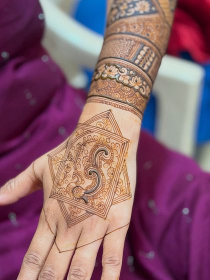 The design in progress, showing the fine lines of the initial sketch before the full pattern is filled in.