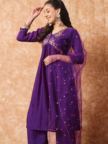 A wine-colored kurta pant set with a flattering A-line silhouette. The thread embroidery on the yoke adds a beautiful detail.