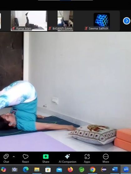 A student in Halasana (Plow Pose) during the thyroid workshop. This inversion compresses the throat region, which can help to stimulate and regulate the thyroid gland.