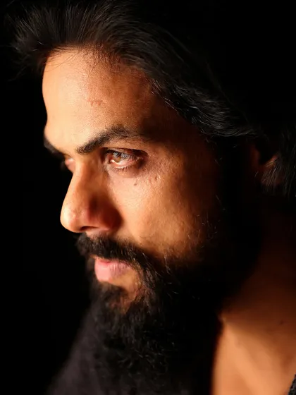 A close-up profile of Arpit Ranka. This shot highlights his strong features and maintains the intense, character-driven theme of his session.