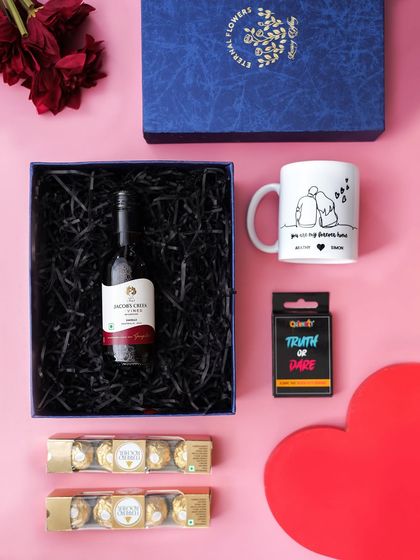 The 'A Toast to Love' hamper with an alternate mug design, showing a cute illustration of a couple. This demonstrates how items can be customized to the client's preference.