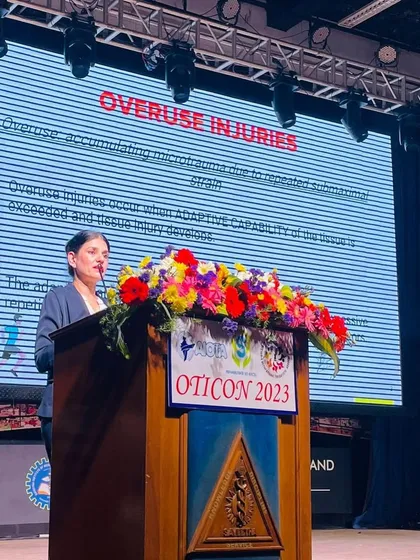 Beyond the track, Dr. Indu Tandon shares her expertise on sports injuries at a conference. Her dual role as an athlete and occupational therapist provides unique insights into injury prevention and management.