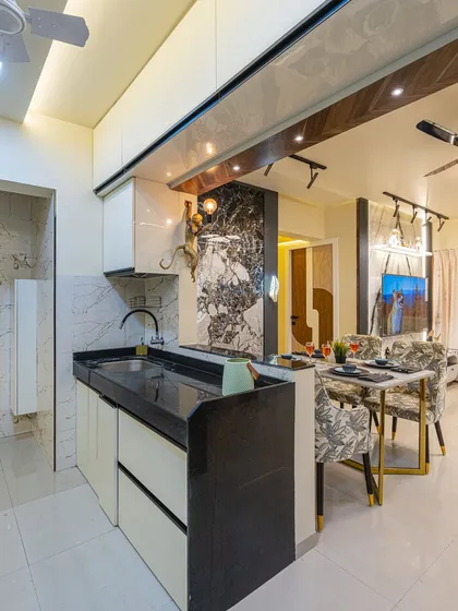 This kitchen features a breakfast counter that also acts as a partition from the dining area. It’s a great way to add informal seating and extra counter space.