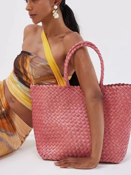 Our Axel Large Tote in a lovely Blush Pink. This bag offers ample space for all your essentials and adds a delightful pop of color, perfect for a day out or a beach getaway.