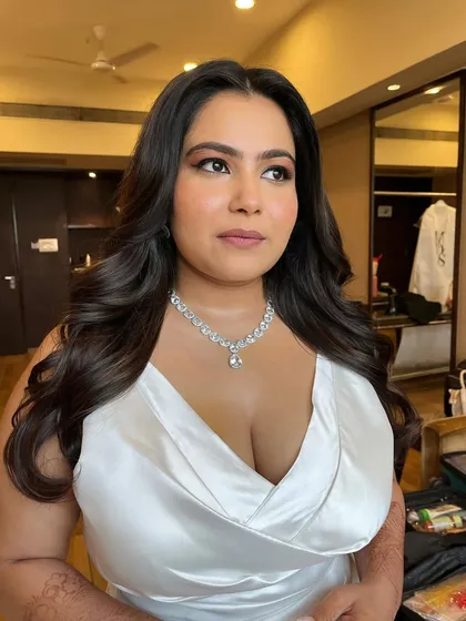 A final portrait of this stunning bride. The makeup is flawless, and she radiates confidence and happiness.
